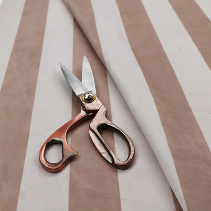 A vertically striped fabric pattern featuring alternating bands of taupe or beige and white