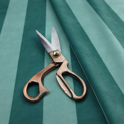 A vertically striped fabric pattern featuring alternating bands of dark teal and a lighter mint green or blue-green tone