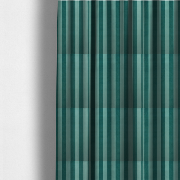 The fabric used to create these made-to-measure curtains is a vertically striped fabric pattern featuring alternating bands of dark teal and a lighter mint green or blue-green tone