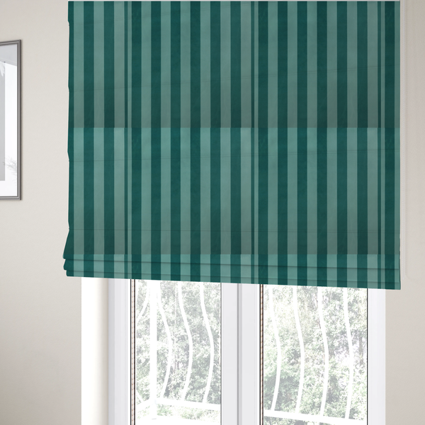 The fabric used to create these Roman blinds is a vertically striped fabric pattern featuring alternating bands of dark teal and a lighter mint green or blue-green tone