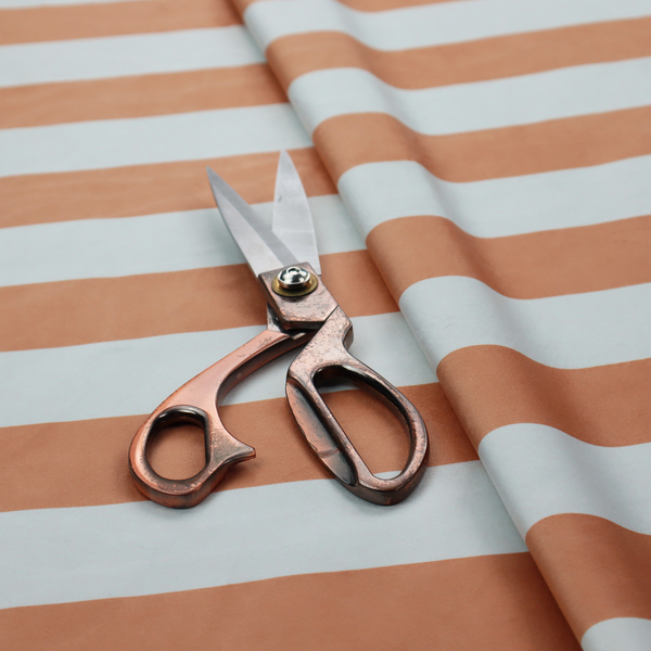 A horizontally striped fabric pattern featuring alternating bands of warm terracotta orange and white.