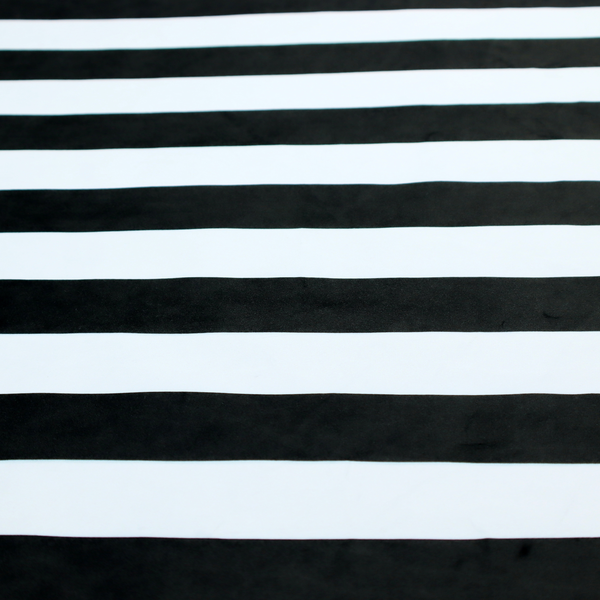 A horizontally striped fabric pattern featuring alternating bands of dark black and white.   