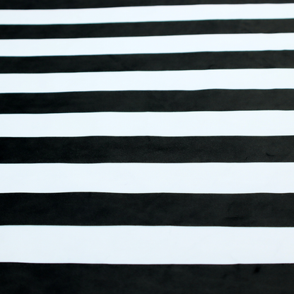 A horizontally striped fabric pattern featuring alternating bands of dark black and white.   