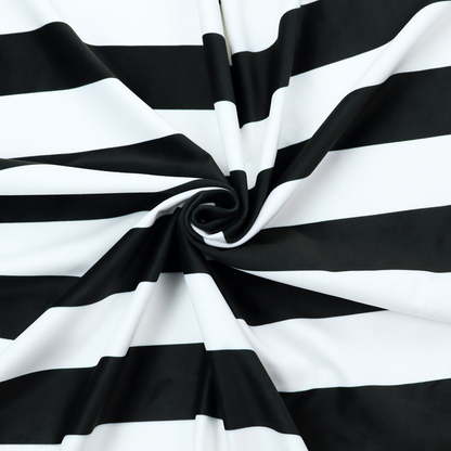A horizontally striped fabric pattern featuring alternating bands of dark black and white.   