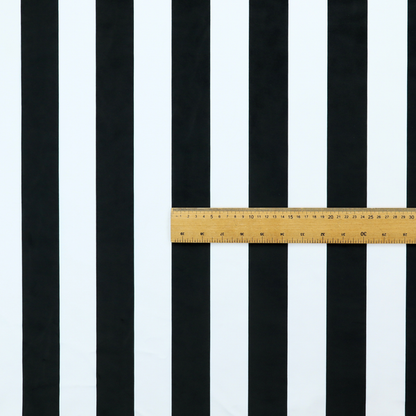 A horizontally striped fabric pattern featuring alternating bands of dark black and white.   