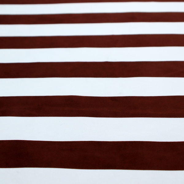 A horizontally striped fabric pattern featuring alternating bands of dark brown and white.