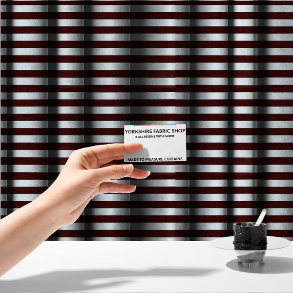 The fabric used to create these made-to-measure curtains is a horizontally striped fabric pattern featuring alternating bands of dark brown and white.