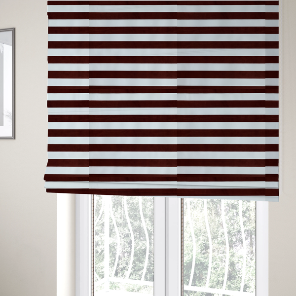 The fabric used to create these Roman blinds is a horizontally striped fabric pattern featuring alternating bands of dark brown and white.