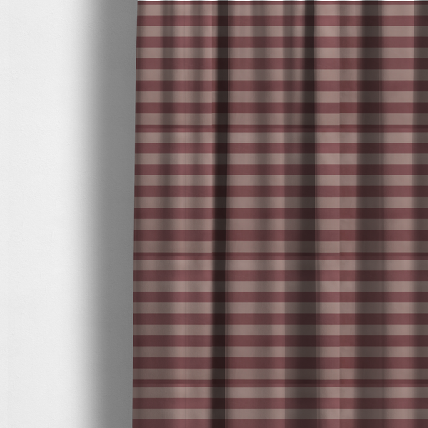 The fabric used to create these made-to-measure curtains is a horizontally striped fabric pattern featuring alternating bands of muted dusty pink and a lighter mauve or rose tone.