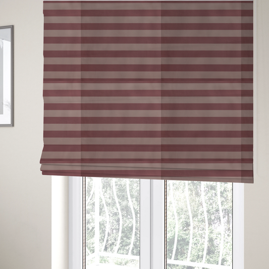 The fabric used to create these Roman blinds is a horizontally striped fabric pattern featuring alternating bands of muted dusty pink and a lighter mauve or rose tone.