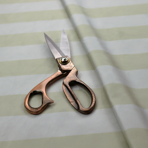A horizontally striped fabric pattern featuring alternating bands of soft sage green or cream-beige and white.