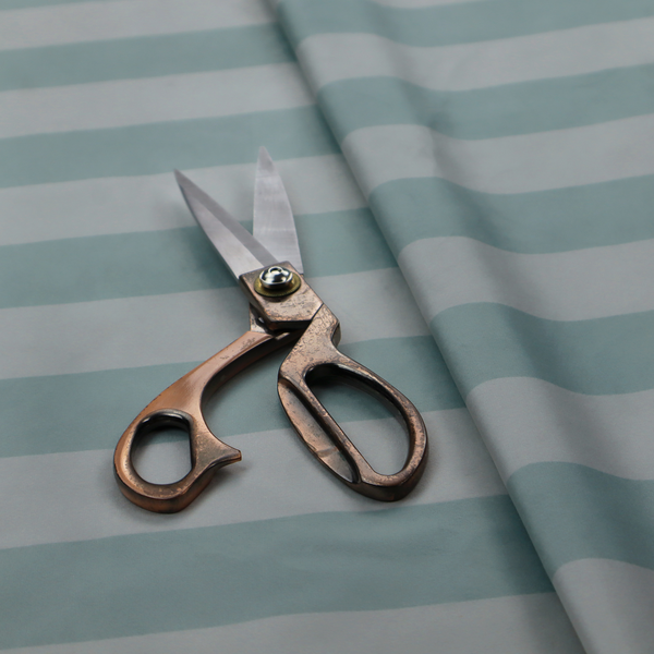 A horizontally striped fabric pattern featuring alternating bands of soft duck egg blue and white.