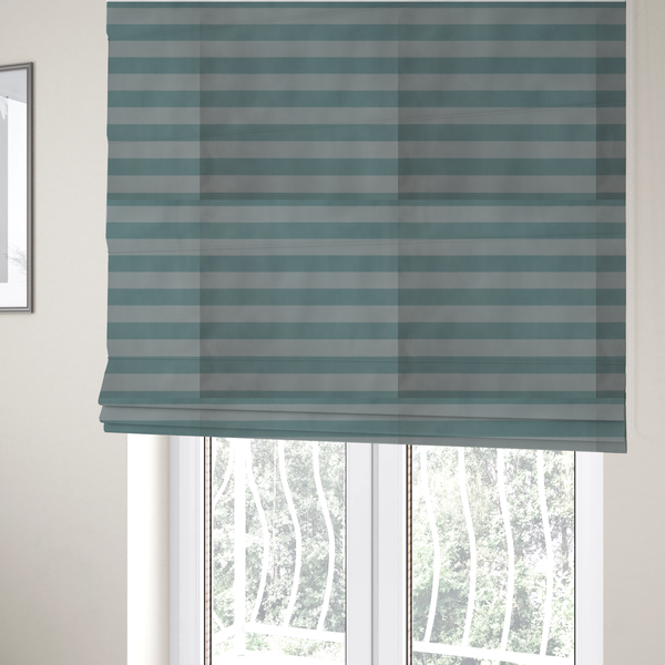 The fabric used to create these Roman blinds is a horizontally striped fabric pattern featuring alternating bands of soft duck egg blue and white.