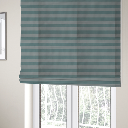The fabric used to create these Roman blinds is a horizontally striped fabric pattern featuring alternating bands of soft duck egg blue and white.