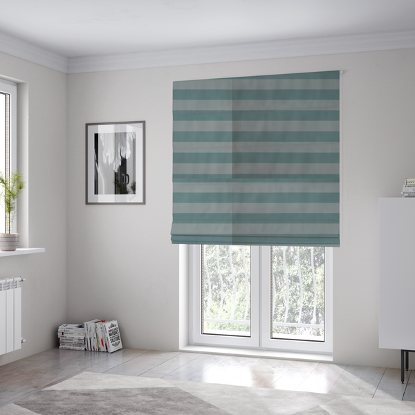 The fabric used to create these Roman blinds is a horizontally striped fabric pattern featuring alternating bands of soft duck egg blue and white.