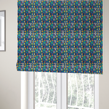 The fabric used to create these Roman blinds is a repeating festive Christmas print on a royal blue background featuring cute cartoon holiday characters, including koalas wearing Santa hats, hedgehogs with antlers, giraffes, Christmas trees, wrapped presents, and stars.   
