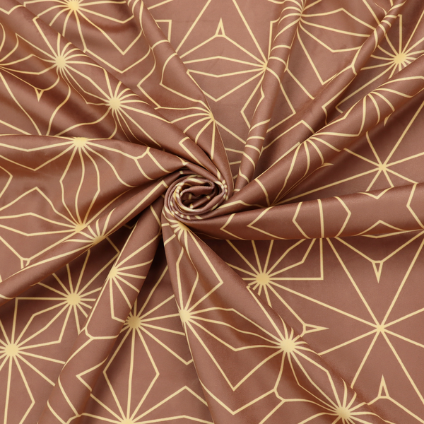 A geometric upholstery fabric featuring an intricate, repeating starburst and lattice pattern in cream lines on a warm terracotta brown background.   