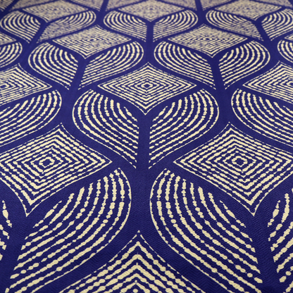 A geometric upholstery fabric featuring an elegant, symmetrical pattern of interlocking diamond shapes and stylized, dotted leaf arches in cream on a royal blue background.   
