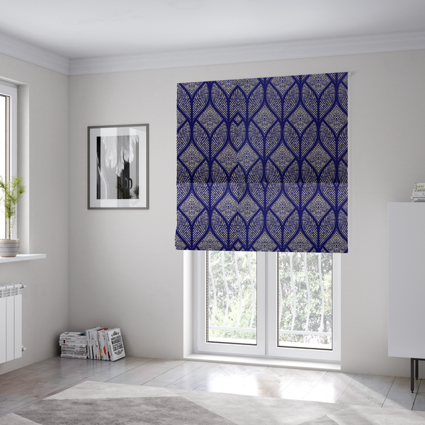 The fabric used to create these Roman blinds is a geometric upholstery fabric featuring an elegant, symmetrical pattern of interlocking diamond shapes and stylized, dotted leaf arches in cream on a royal blue background.   
