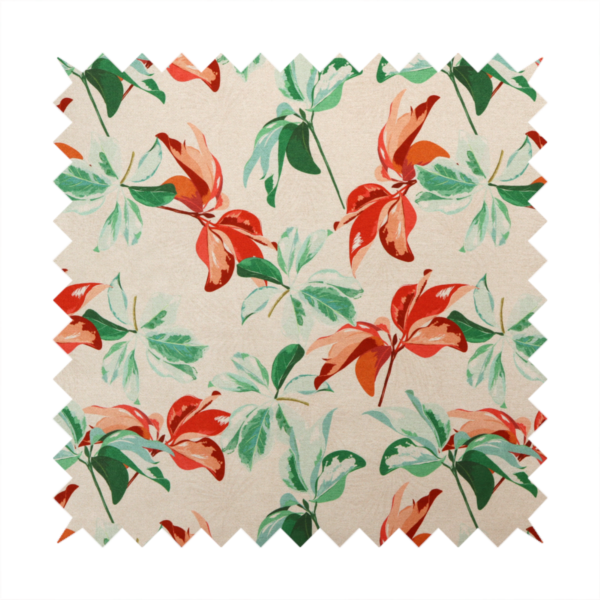 A botanical upholstery fabric on a neutral cream background featuring a repeating painterly pattern of leafy branches in shades of vibrant orange, coral, deep green, and pale mint-green.   