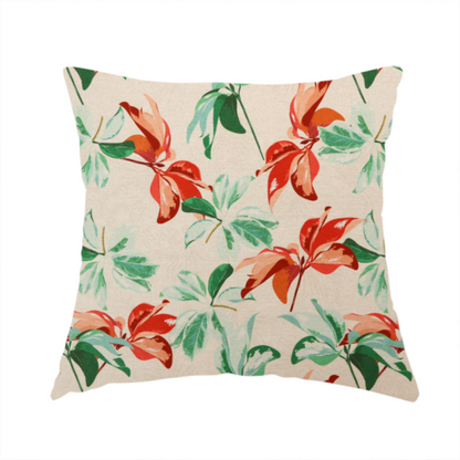 The fabric used to create this handmade cushion is a botanical upholstery fabric on a neutral cream background featuring a repeating painterly pattern of leafy branches in shades of vibrant orange, coral, deep green, and pale mint-green.   