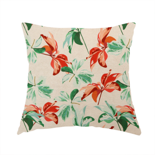 The fabric used to create this handmade cushion is a botanical upholstery fabric on a neutral cream background featuring a repeating painterly pattern of leafy branches in shades of vibrant orange, coral, deep green, and pale mint-green.   