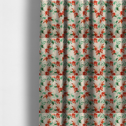 The fabric used to create these made-to-measure curtains is a botanical upholstery fabric on a neutral cream background featuring a repeating painterly pattern of leafy branches in shades of vibrant orange, coral, deep green, and pale mint-green.   