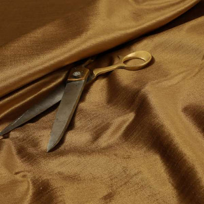 Rome Designer Silk Shine Velvet Effect Chenille Plain Furnishing Fabric In Gold Colour