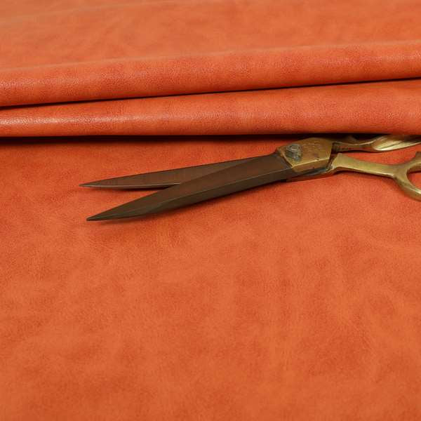 Suffolk Vinyl Upholstery Material Slippery Wet Feel Orange Colour Faux Leather