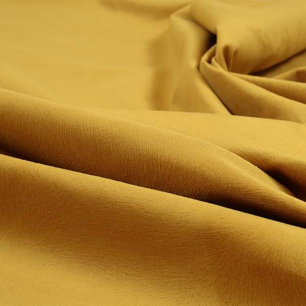 Tanisha Gold Yellow Colour Soft Velvet Upholstery Fabric In Embossed Self Pattern Design